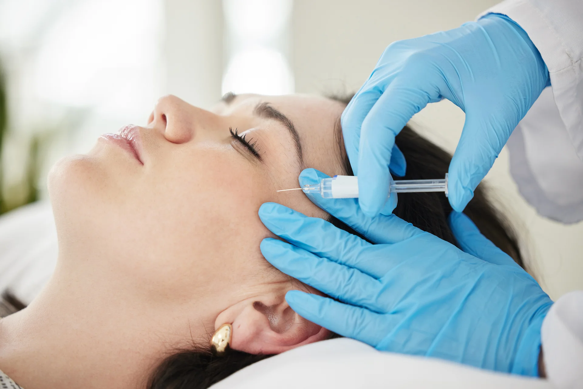 A Woman Getting Cheek Filler Treatment|