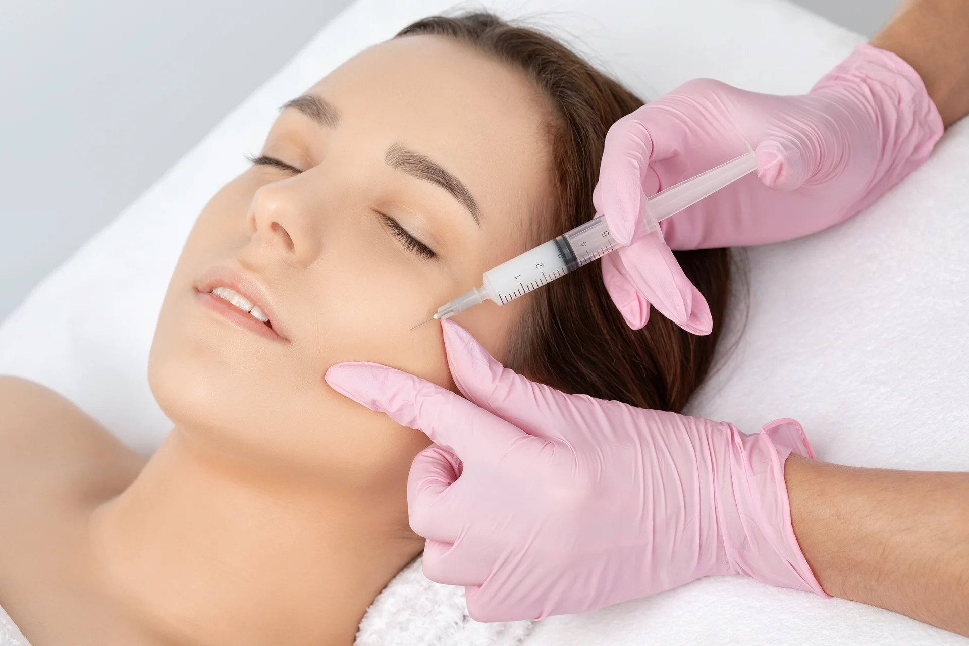 A Woman Getting Cheek Filler Injection||