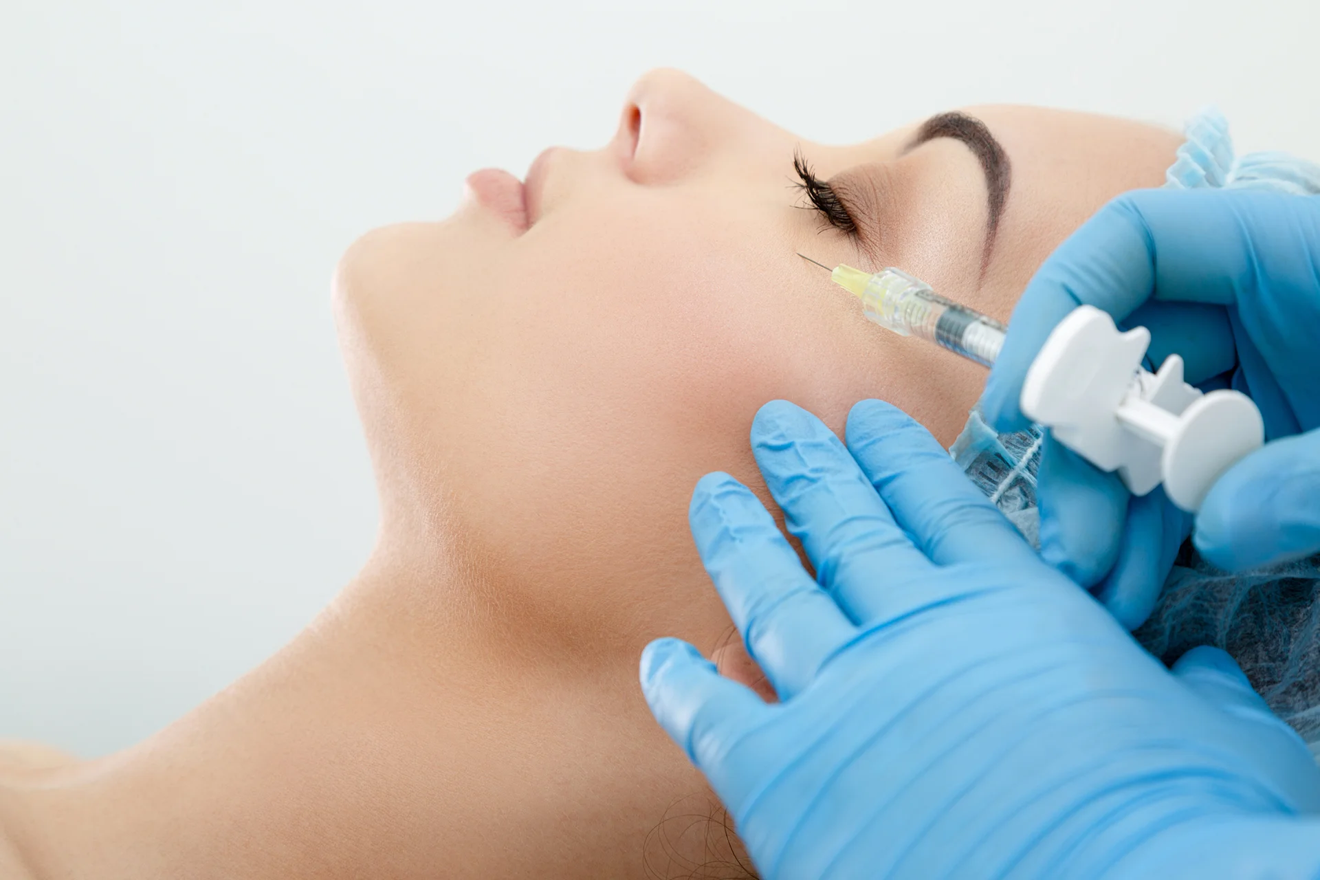 A Woman Getting Cheek Filler Treatment||