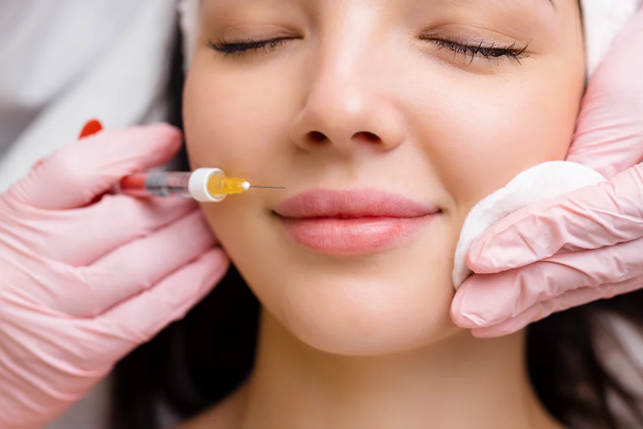 a woman received dermal filler injections at a beauty clinic
