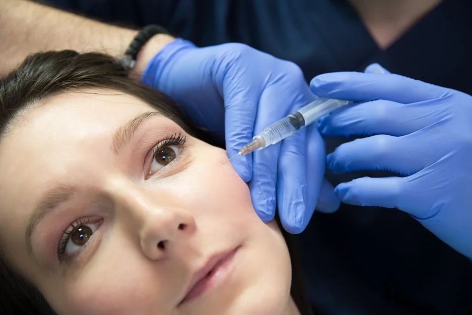 A Woman getting Cheek Filler Injection